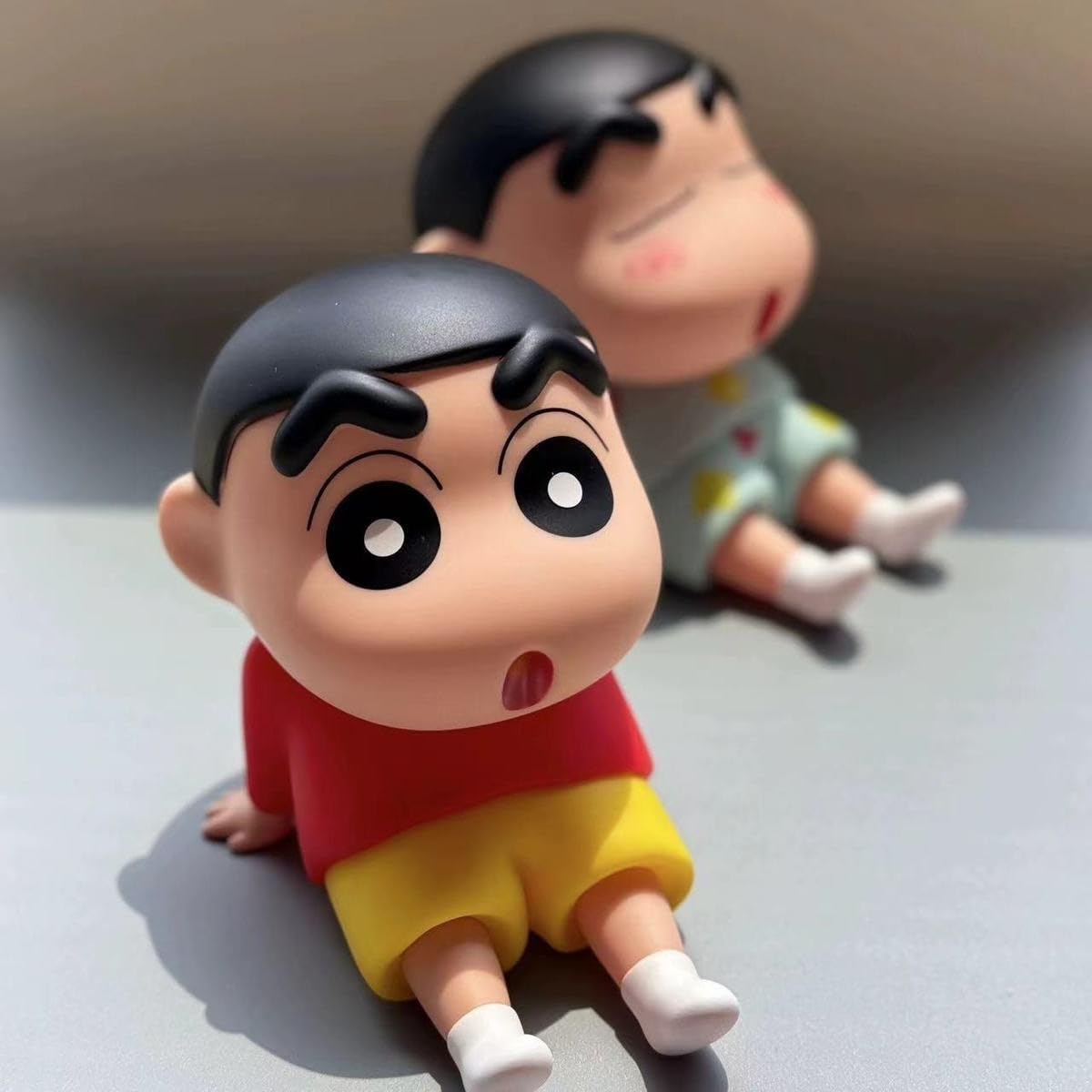 DCELLA Cute Shin-Chan Mobile Stand (Cyan and Red) – Cute ABS Cartoon Phone Holder for Desk or Tabletop Use, Flexible and Lightweight Design for Daily Utility or Gifting (Pack of 2)